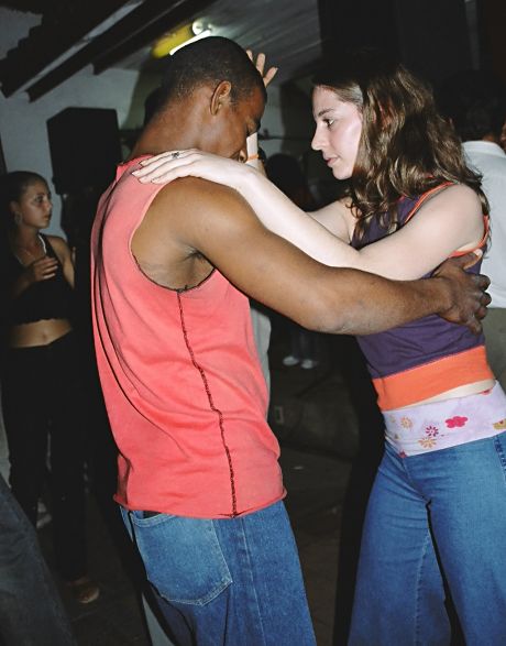 Galia is dancing Salsa with a local guy, in Viniales