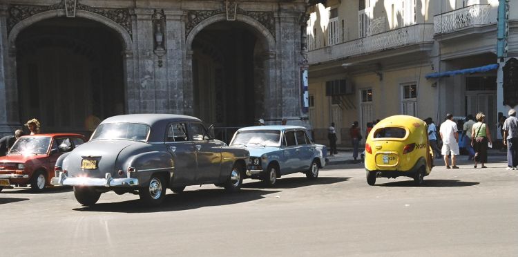 Variety of Cuban vehicles: old American car, Russian Lada & Coco-Taxi