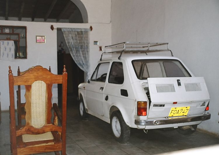 Fiat car parks inside a living room - how did it get in?