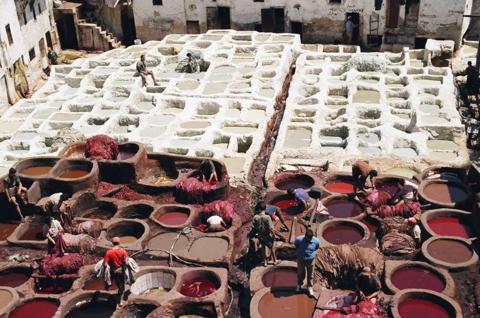 Leather dyeing at traditional tannery, Fes Medina