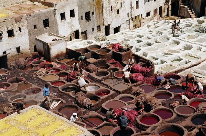 White vats are used for cleaning the leather, colored vats are used for tanning. Fes Medina
